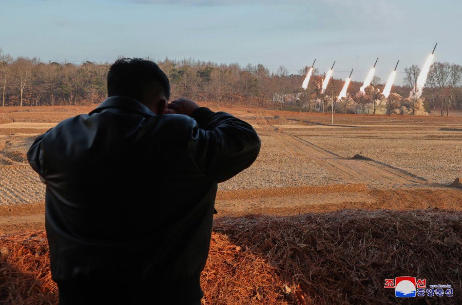 A photo released via North Korea state media KCNA said to show Kim Jong-un observing the launch of ballistic missiles from the KN-25  multi-launch rocket system